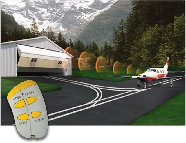 Schweiss remote controls in use for hangar door from inside airplane