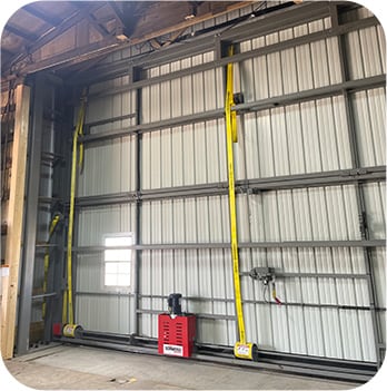 Interior view of Schweiss Lift Straps on closed bifold door