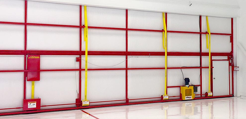 Yellow Liftstraps on Bifold Hangar Doors