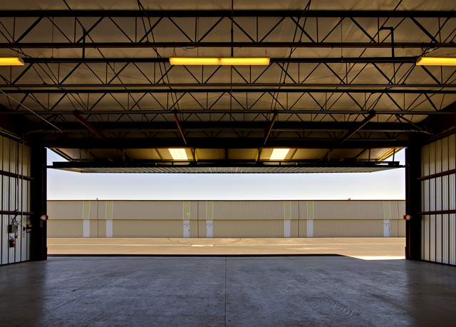 Inside view of steel t-hangar building with bifold door