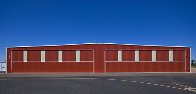 two bifold doors on large steel building hangar