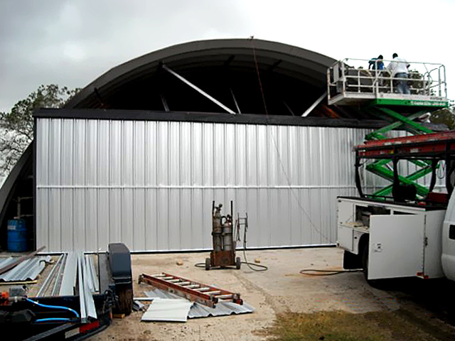 bifold door with free standing header on quonset building