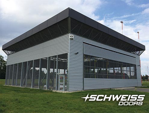 Bifold doors for Belgian Airforce's Helicopter Hangars got custom weatherproofed motors and limit boxes