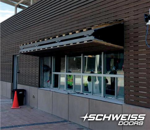 Concession Stand Door at Riversedge Park is clad in cedar slats