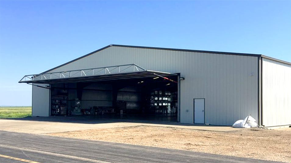 Angled view of Schweiss hydraulic door fitted on Agtegra Cooperative Aerial Spraying Division