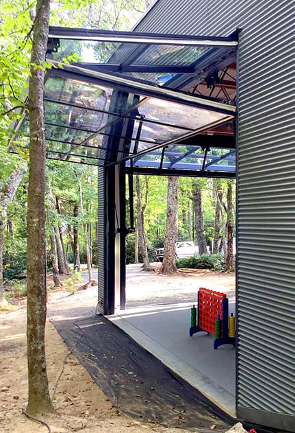 Side view of one of the Schweiss glass bifold doors installed on Blue Ridge Art Studio