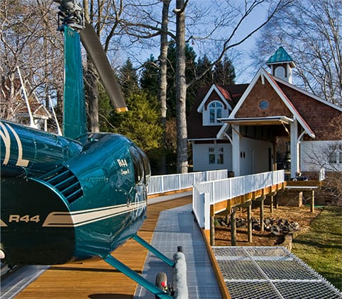 Schweiss hydraulic door on Carriage House viewed from pier