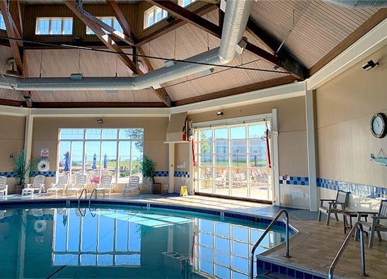 Interior view of Schweiss hydraulic door fitted on The Lodge at Geneva on the Lake for the indoor pool shown in the closed position