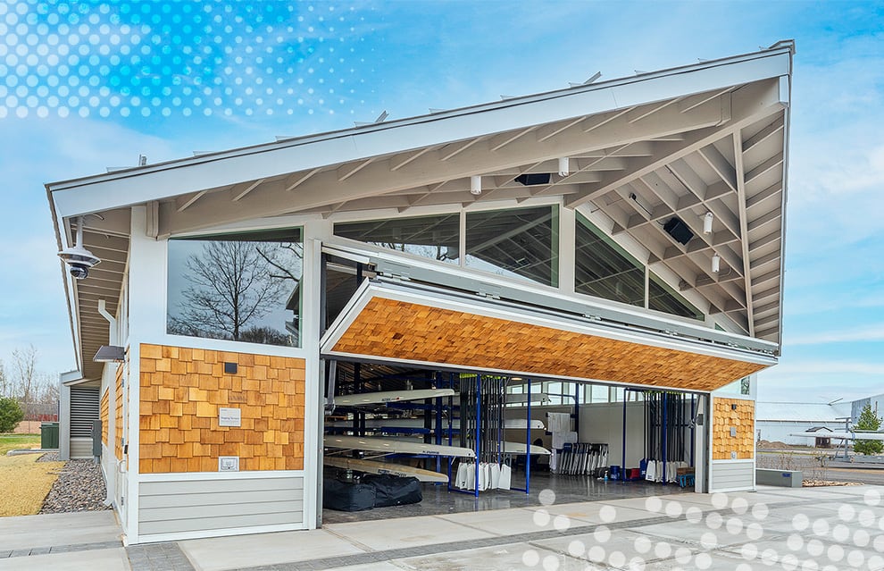 Exterior view of Schweiss bifold door fitted on Hamilton College boathouse shown open