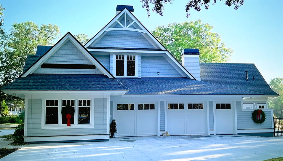 Schweiss designer hydraulic door with custom gabled end fitted on a home in Charleston shown closed