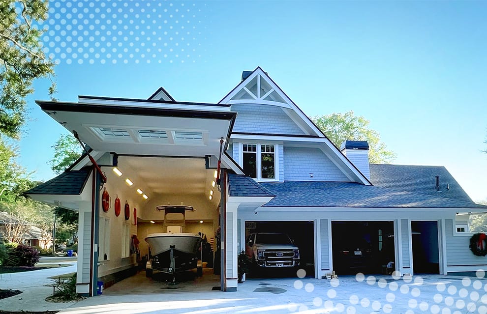 Schweiss designer hydraulic door with custom gabled end fitted on a home in Charleston shown open