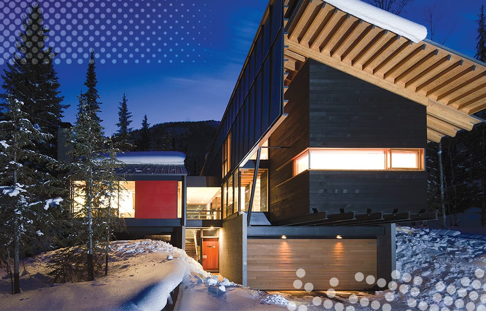 Custom Schweiss hydraulic door with wood cladding fitted on Kicking Horse Ski Resort