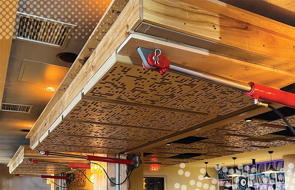 Two opened Schweiss hydraulic doors used as a separator in Macanda Mexican Restaurant viewed from the right side