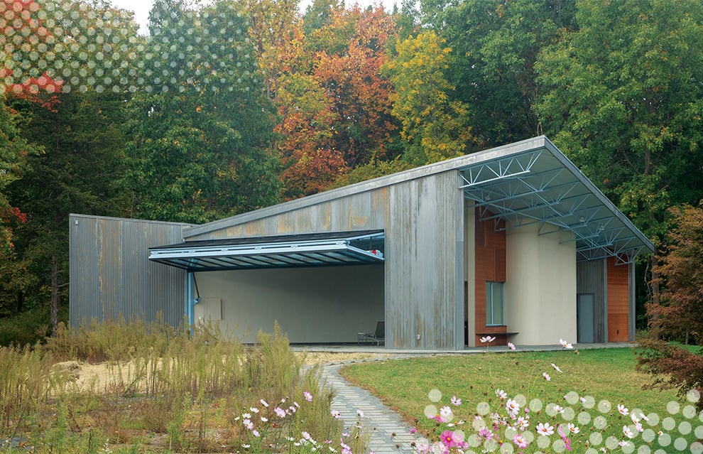 Wide shot of NY Pool House fitted with a Schweiss bifold door shown open