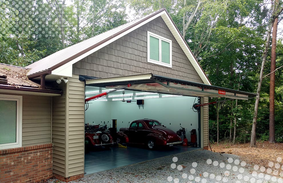 Custom Schweiss hydraulic door fitted on Odd Job Johnny's garage shown open