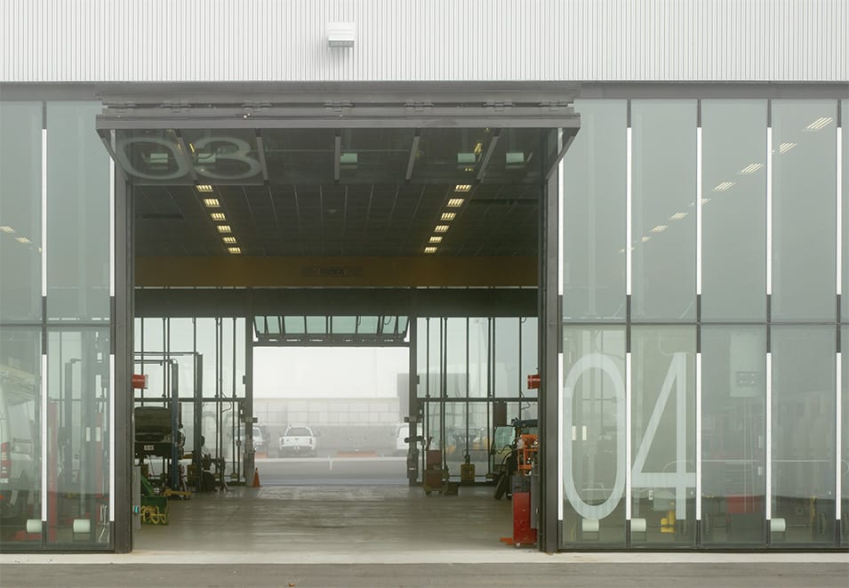 Frontal view of custom Schweiss glass bifold door installed on new Operations HQ in Newmarket, Ontario