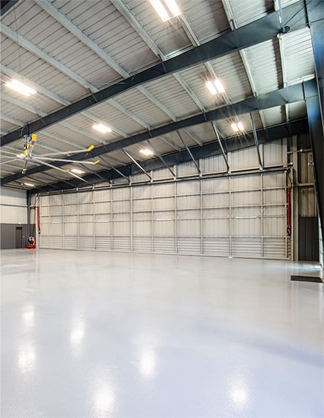 Interior view of Prime Metal Buildings & Components new hangar fitted with a Schweiss hydraulic door shown closed