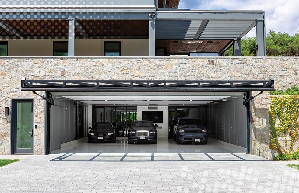 Front view of opened glass Schweiss hydraulic door fitted on Eddie's garage that houses Rolls Royce vehicles