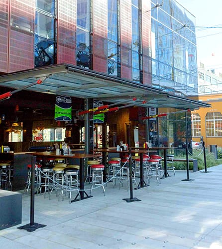 Schweiss hydraulic doors fitted on Sams Tavern over the patio shown in the open position