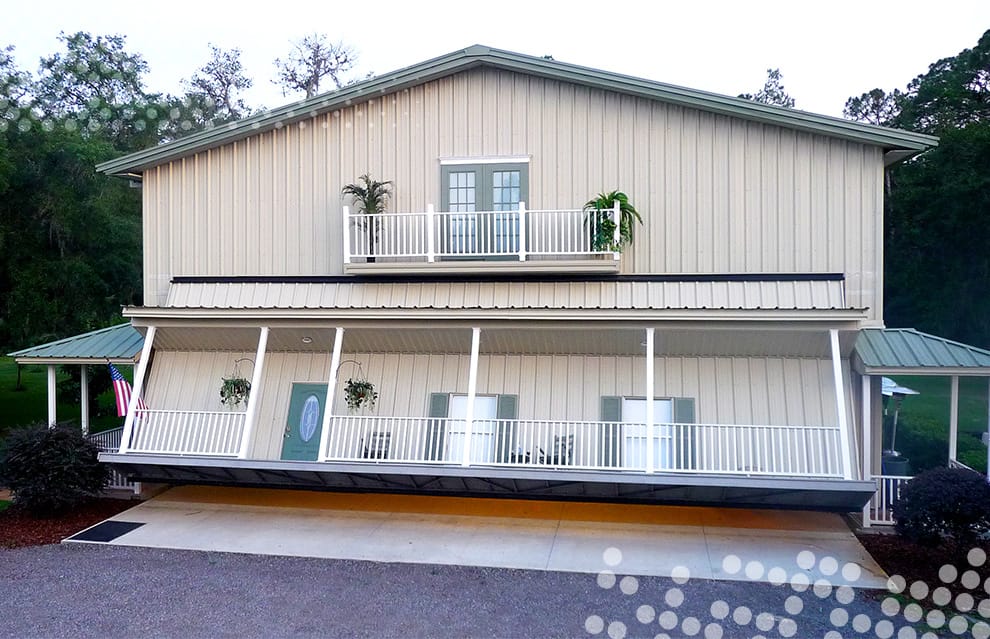 Unique Schweiss hydraulic door with full porch fitted on Shaw hangar home shown opening