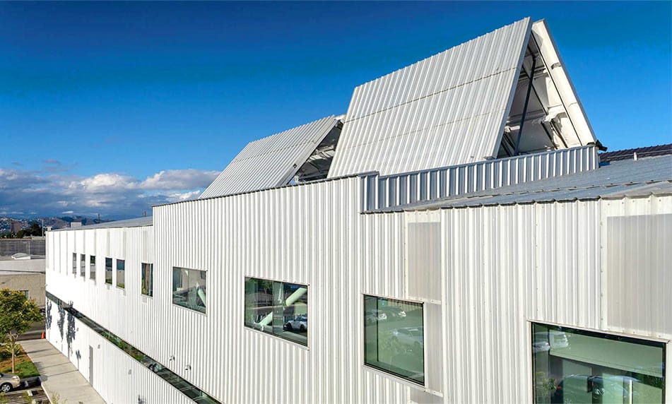 Exterior view of the Schweiss bifold doors being used as skylight windows on Tin Can Project