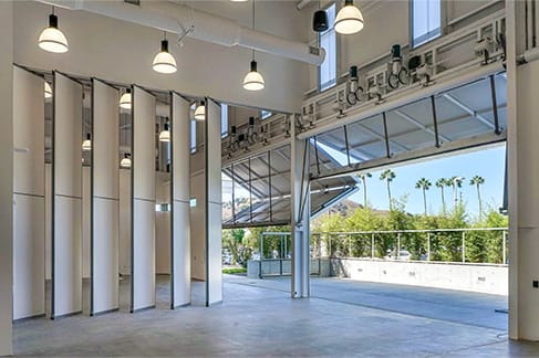 Interior view of Schweiss bifold doors fitted on the ground floor of the Tin Can Project