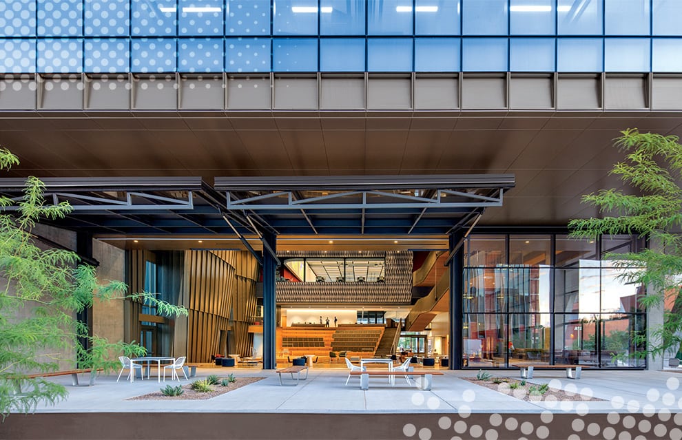 Exterior view of the three glass hydraulic Schweiss doors that make up a full wall of the Health Science building at the University of Arizona