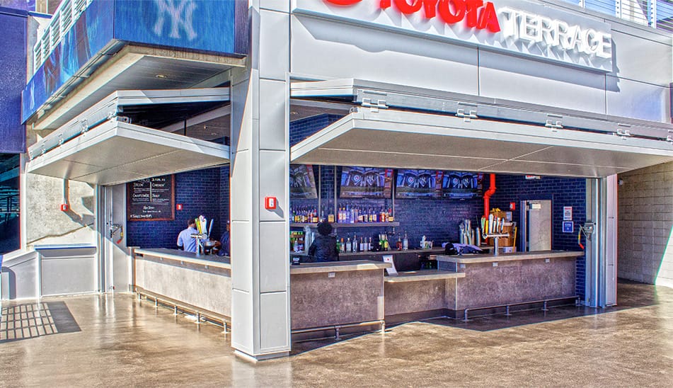 Multiple Schweiss bifold doors installed on concession stands within Yankee Stadium