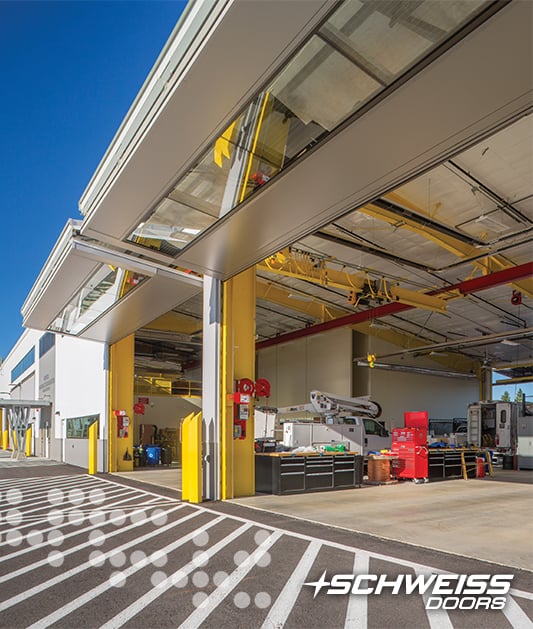 Shop bldg had 11 bifold Doors installed allowing vehicles to drive through