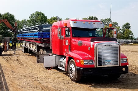 Schweiss Hangar Door Delivery from Minnesota going North to Canada