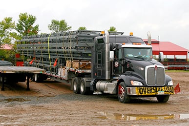 Schweiss door loaded on black semi truck ready for delivery