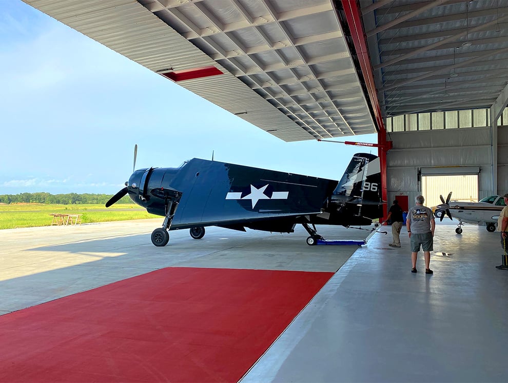 Schweiss Large Hydraulic Doors open up to prep airplane