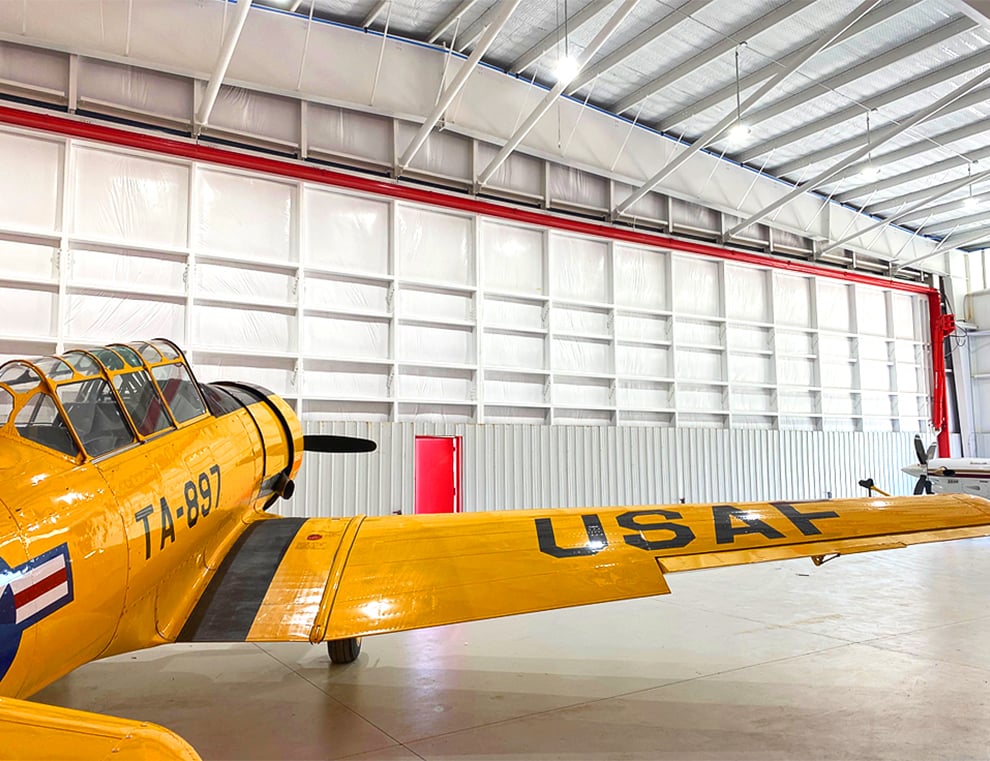 Schweiss Large Hydraulic Doors protect airplanes