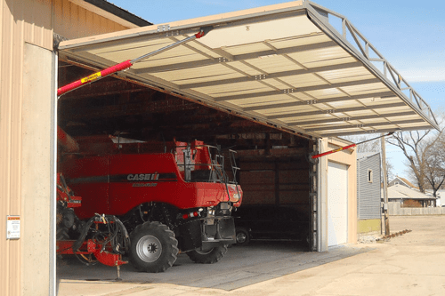 Combines stored inside shop with Schweiss Hydraulic Door 