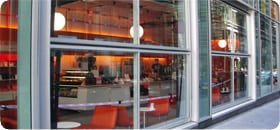 glass bifold doors line exterior of ny restaurant