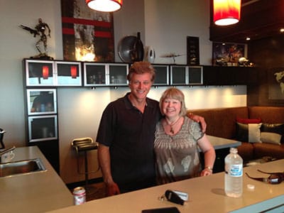 Patrick and Gladie Hagen standing inside the hangar living area