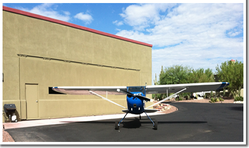 Hydraulic Hangar Door with Stucco siding to match building