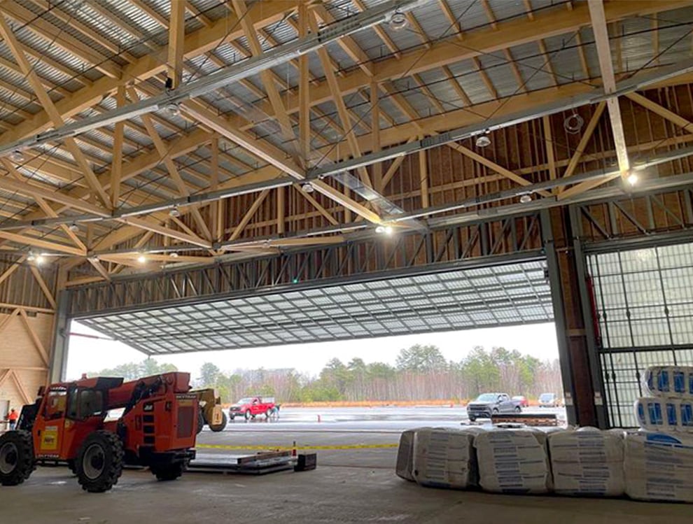 Hangar fitted with 120ft Schweiss Stand-Alone Hydraulic Door shown in the open position