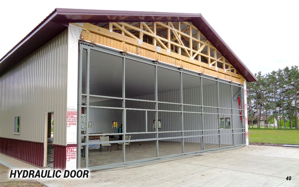 Hydraulic door being installed on building